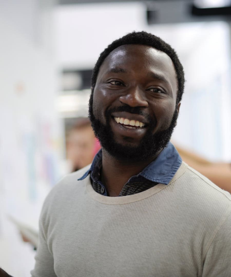 Smiling business owner in his office