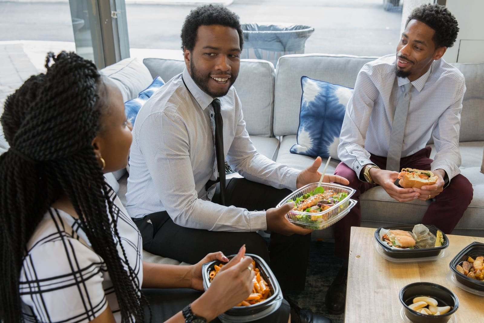 Coworkers laughing together over lunch